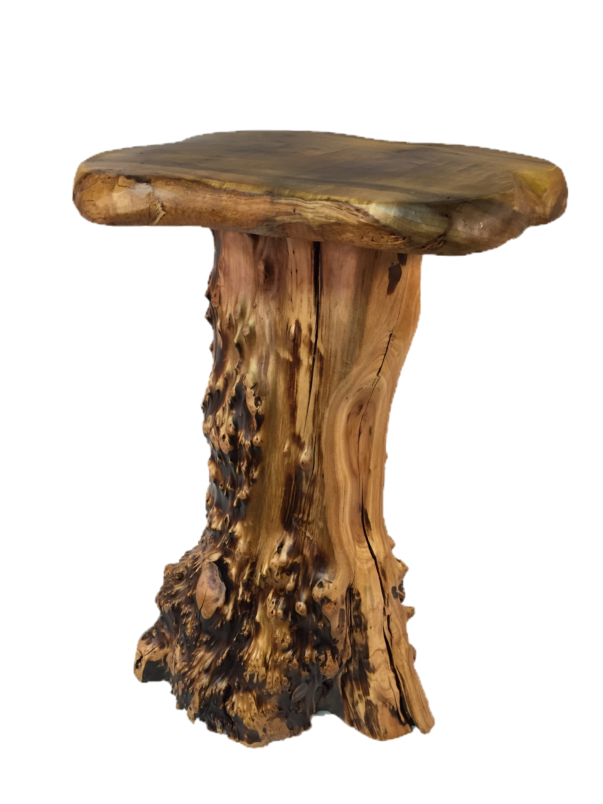 FUNCTIONAL ART is the best way to describe Greener Valley's stunning collection of stumps and roots that have been handcrafted into beautiful wine holders, cheese boards, platters, bowls and stools. Handcrafted from the roots and stumps of the Asian Cypress known as Shan Mu. These beautiful stools function equally well as a stool, end table or plant stand. Each piece is absolutely unique. This stool measures 24" high.