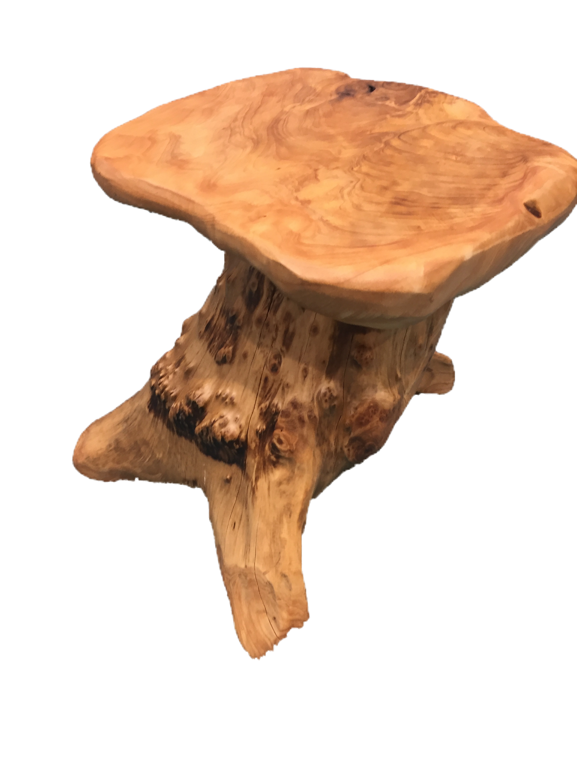 FUNCTIONAL ART is the best way to describe Greener Valley's stunning collection of stumps and roots that have been handcrafted into beautiful wine holders, cheese boards, platters, bowls and stools. Handcrafted from the roots and stumps of the Asian Cypress known as Shan Mu. These beautiful stools function equally well as a stool, end table or plant stand. Each piece is absolutely unique. This stool measures 24" high.