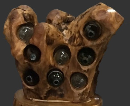 FUNCTIONAL ART is the best way to describe Greener Valley's stunning collection of stumps and roots that have been handcrafted into beautiful wine holders, cheese boards, platters, bowls and stools. Handcrafted from the roots and stumps of the Asian Cypress known as Shan Mu. These beautiful stools function equally well as a stool, end table or plant stand. Each piece is absolutely unique. This stool measures 24" high.
