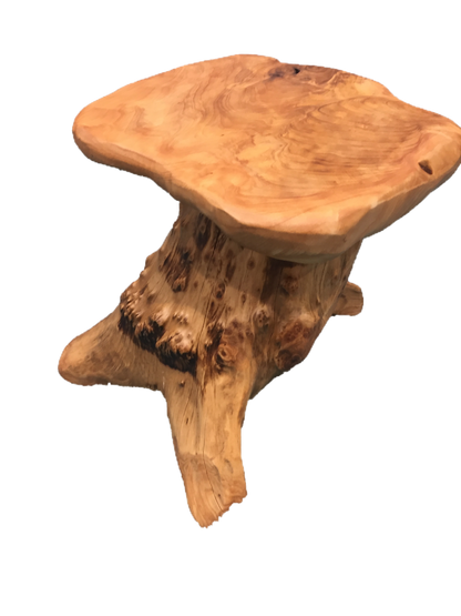FUNCTIONAL ART is the best way to describe Greener Valley's stunning collection of stumps and roots that have been handcrafted into beautiful wine holders, cheese boards, platters, bowls and stools. Handcrafted from the roots and stumps of the Asian Cypress known as Shan Mu. These beautiful stools function equally well as a stool, end table or plant stand. Each piece is absolutely unique. This stool measures 24" high.